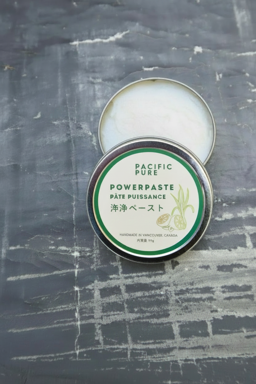Tin of Plantish Powerpaste on a textured gray background